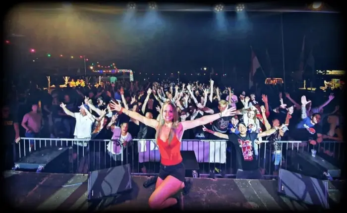 Adrelina dancing in front of the crowd barrier